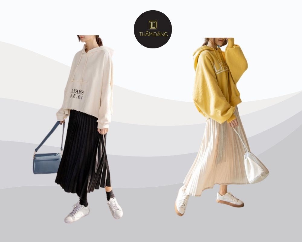Phối chân váy xếp ly dài cùng áo hoodie tạo ra tổng thể kết hợp giữa cá tính và nữ tính duyên dáng